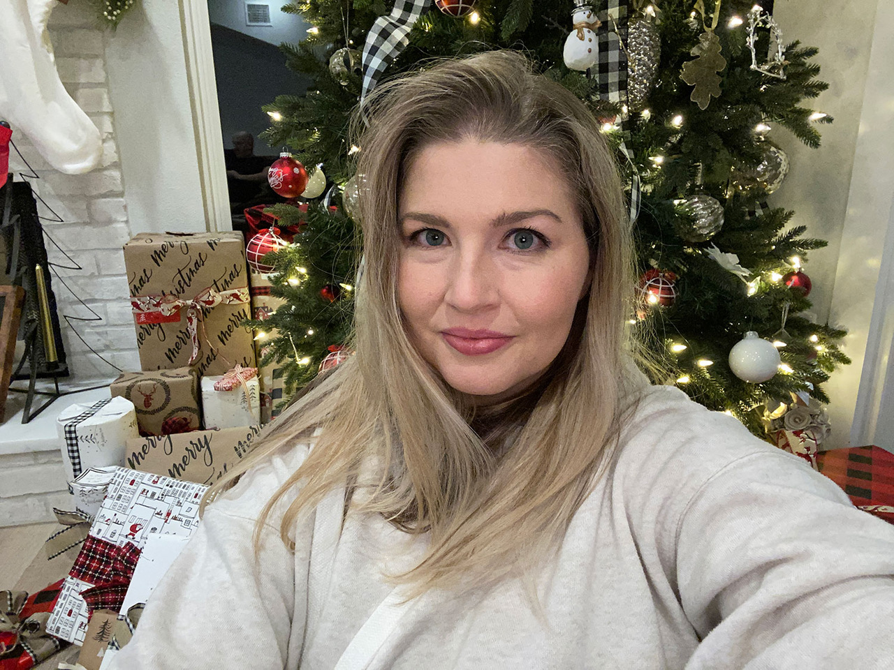 Resilience speaker and author Courtney Clark in front of the Christmas tree