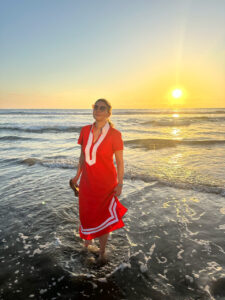 Resilience change speaker Courtney Clark walking on the beach
