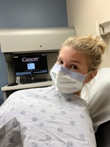 image of resilience keynote speaker Courtney Clark in the hospital cancer treatment