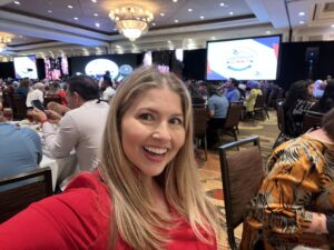 Courtney Clark waiting to deliver a keynote speech.