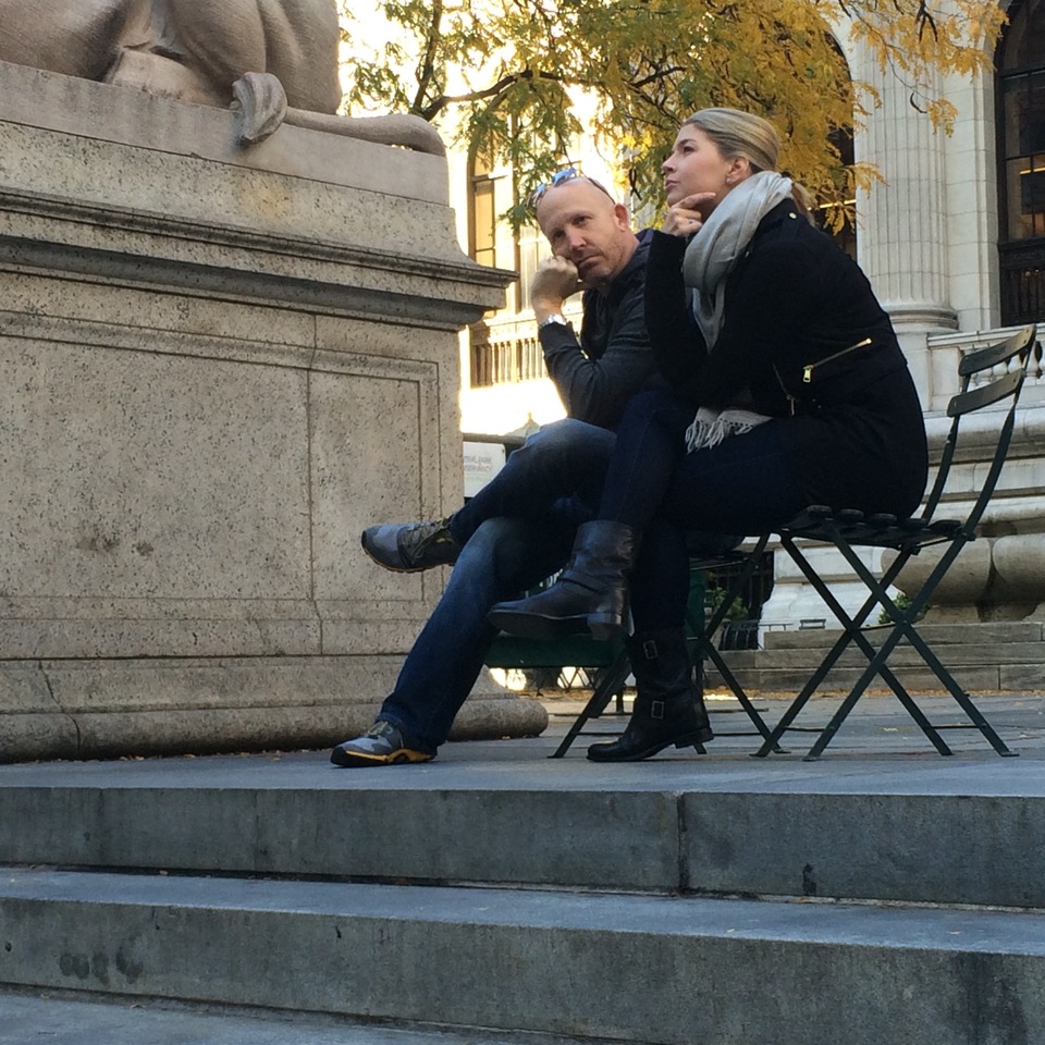couple sitting pensively on steps
